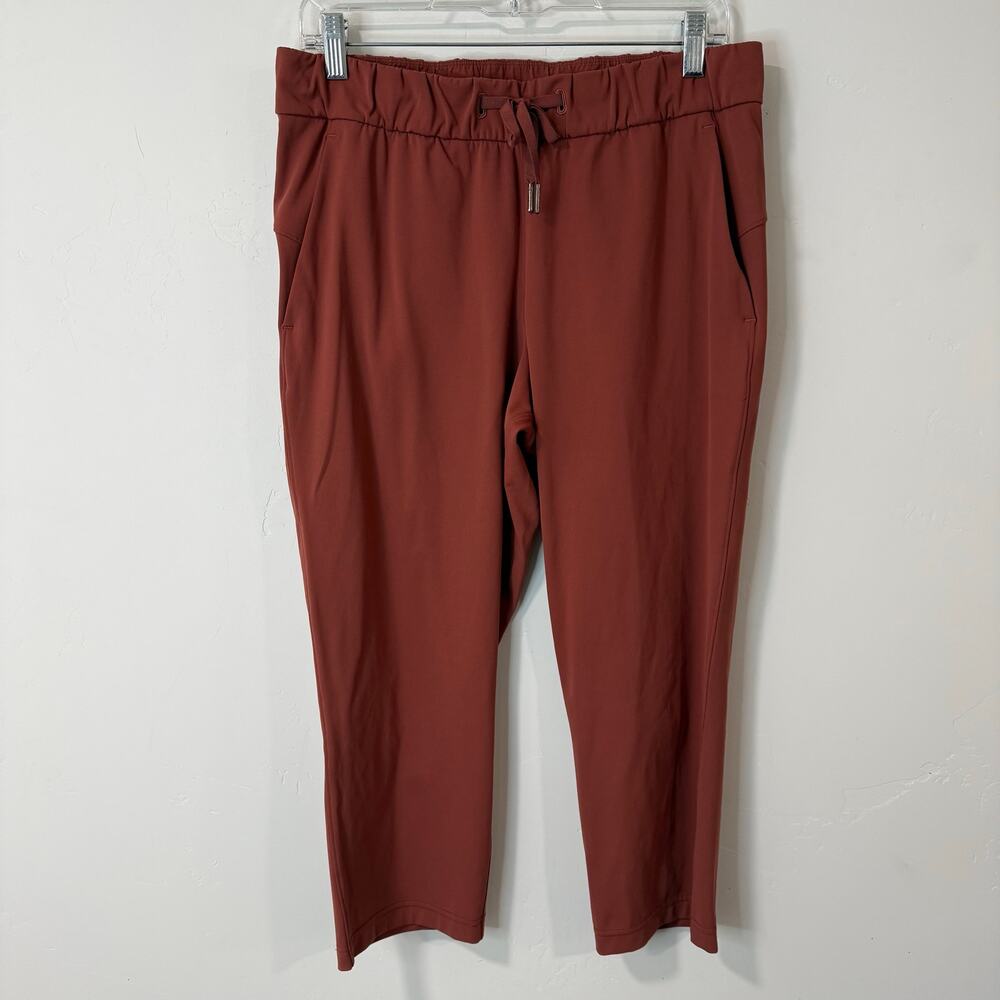 Lululemon Women's On The Fly Crop Pants Luxtreme Stretch Orange Red 8